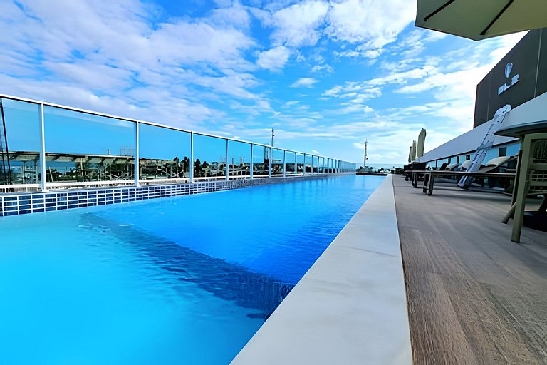 Flat elegante a poucos passos da praia