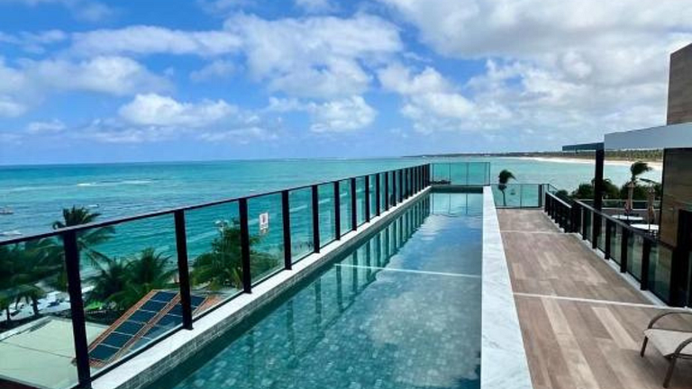 On the sand with private heated pool