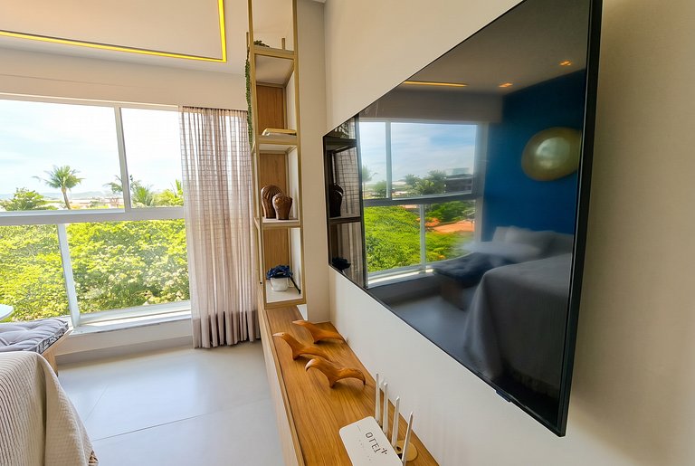 Flat elegante a poucos passos da praia