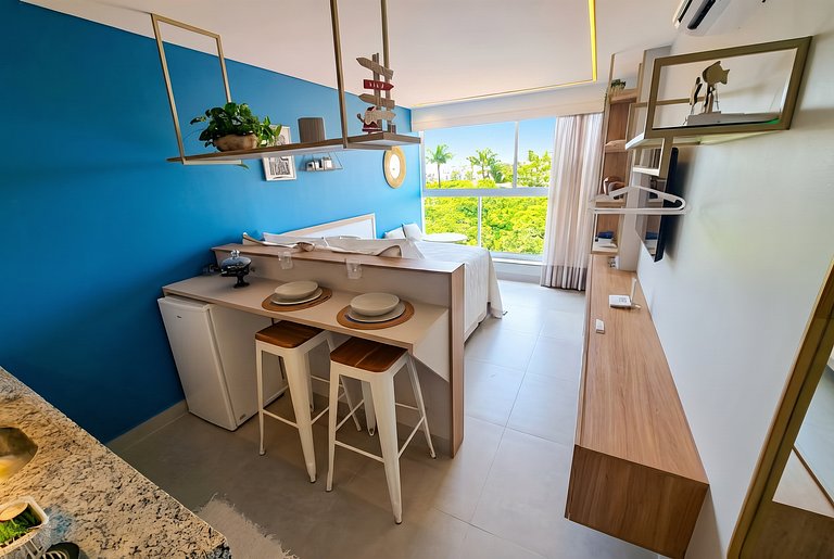 Flat elegante a poucos passos da praia